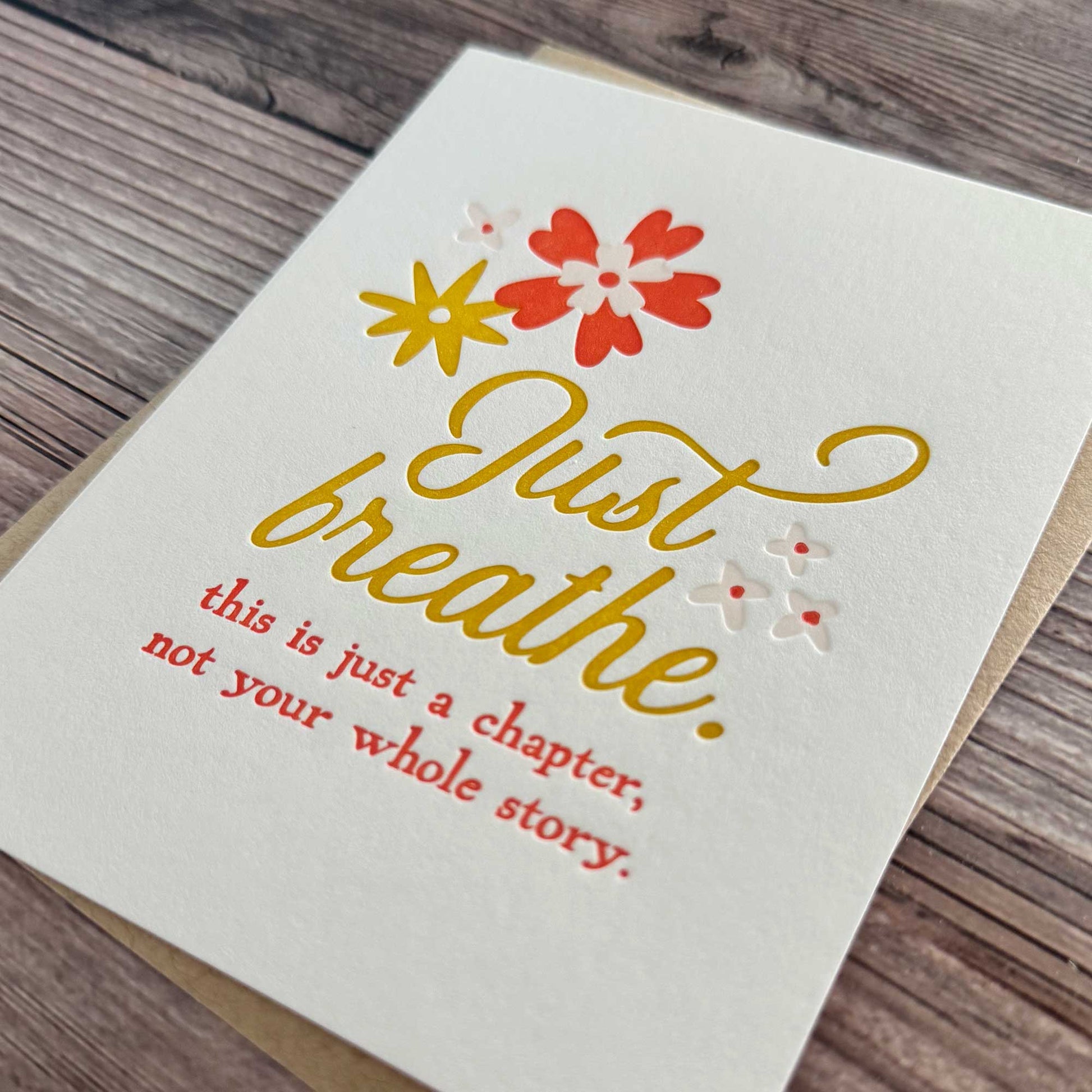Letterpress printed greeting card, floral design, red and yellow. Just Breathe. This is just a chapter, not your whole story. Our "Just Breathe" card is the perfect way to encourage a loved one who’s going through a tough time, reminding them that this challenging moment is just a chapter, not their whole story. Whether they're facing illness, recovery, or emotional hardship, this beautifully letterpress printed card offers thoughtful Cancer Support, Chemo Care, Stroke Support, or even Divorce Support.