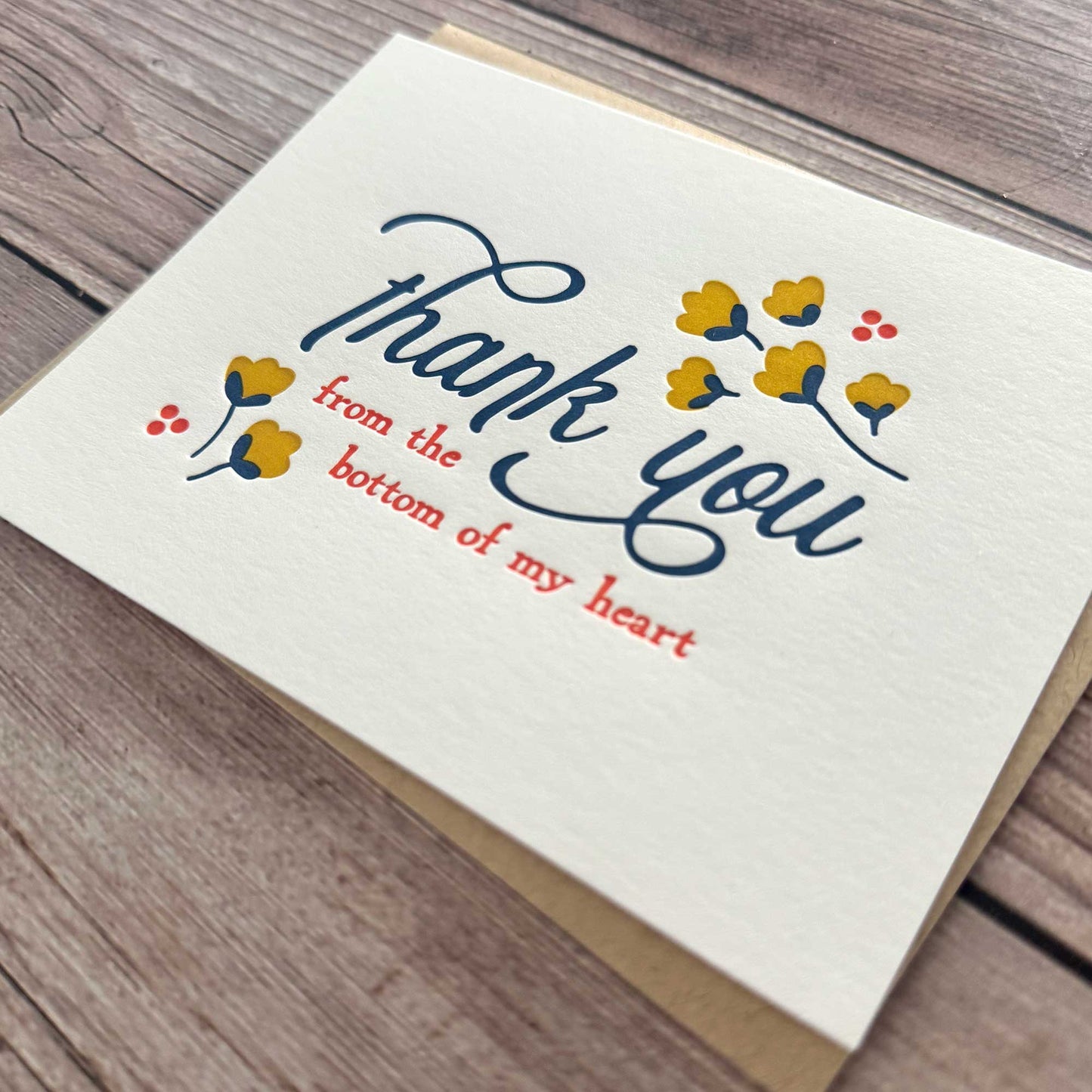 Greeting Card, Letterpress printed, Floral Design, Yellow, blue and Red. "Thank you from the bottom of my heart." These elegant cards are perfect for expressing your appreciation in a thoughtful and personal way, whether for business or personal use. Our Letterpress Thank You Cards are designed with quality in mind, providing a timeless, textured feel that adds a special touch to your messages. Perfect for Graduation thank you cards, Wedding thank you cards, Funeral thank you cards, business thank you cards