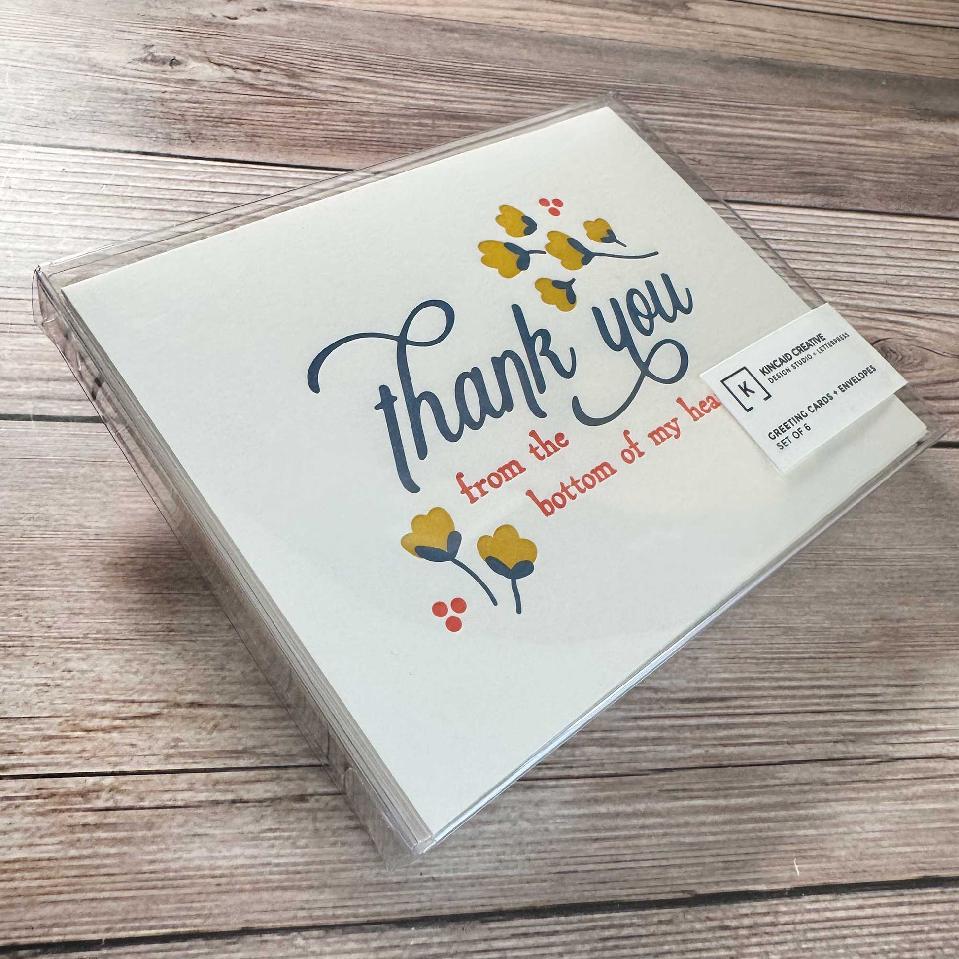 Greeting Card, Letterpress printed, Floral Design, Yellow, blue and Red. "Thank you from the bottom of my heart." These elegant cards are perfect for expressing your appreciation in a thoughtful and personal way, whether for business or personal use. Our Letterpress Thank You Cards are designed with quality in mind, providing a timeless, textured feel that adds a special touch to your messages. Perfect for Graduation thank you, Wedding thank you, Funeral thank you, business thank you, Boxed set of 6 or 12.