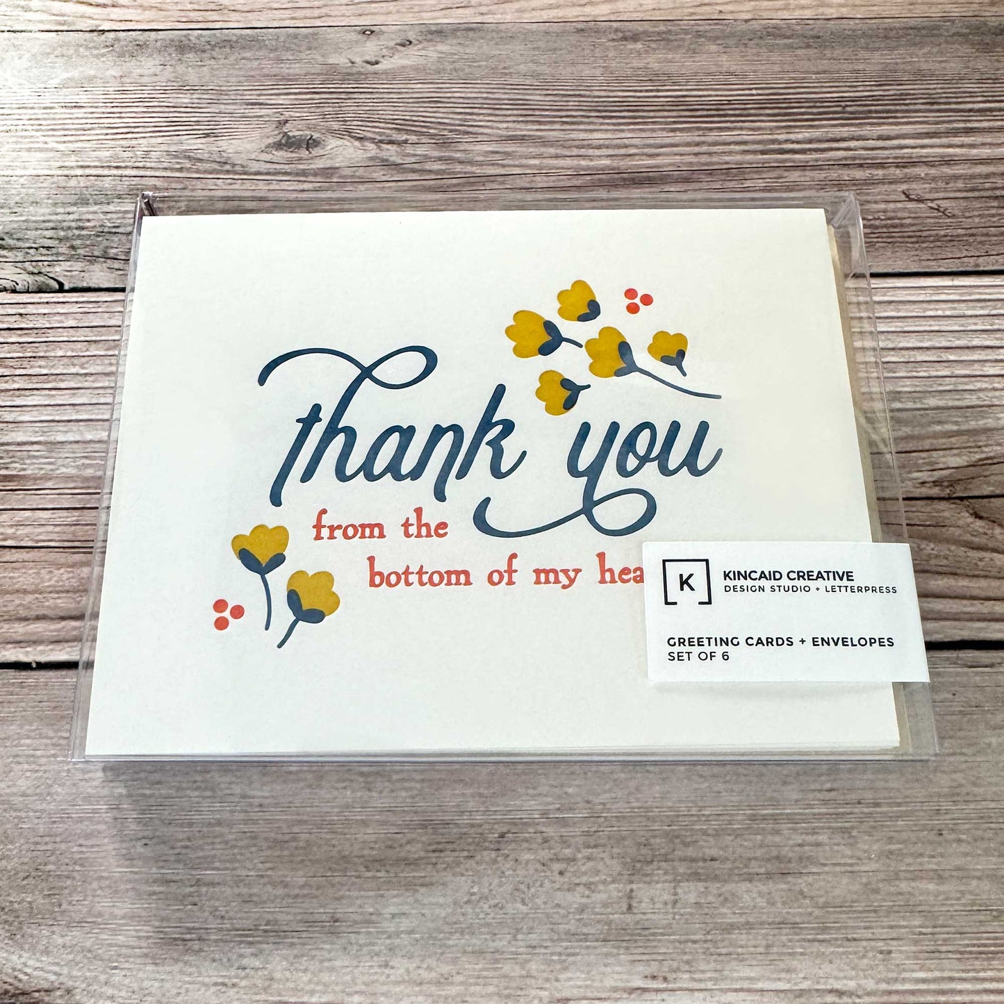 Greeting Card, Letterpress printed, Floral Design, Yellow, blue and Red. "Thank you from the bottom of my heart." These elegant cards are perfect for expressing your appreciation in a thoughtful and personal way, whether for business or personal use. Our Letterpress Thank You Cards are designed with quality in mind, providing a timeless, textured feel that adds a special touch to your messages. Perfect for Graduation thank you, Wedding thank you, Funeral thank you, business thank you, Boxed set of 6 or 12.