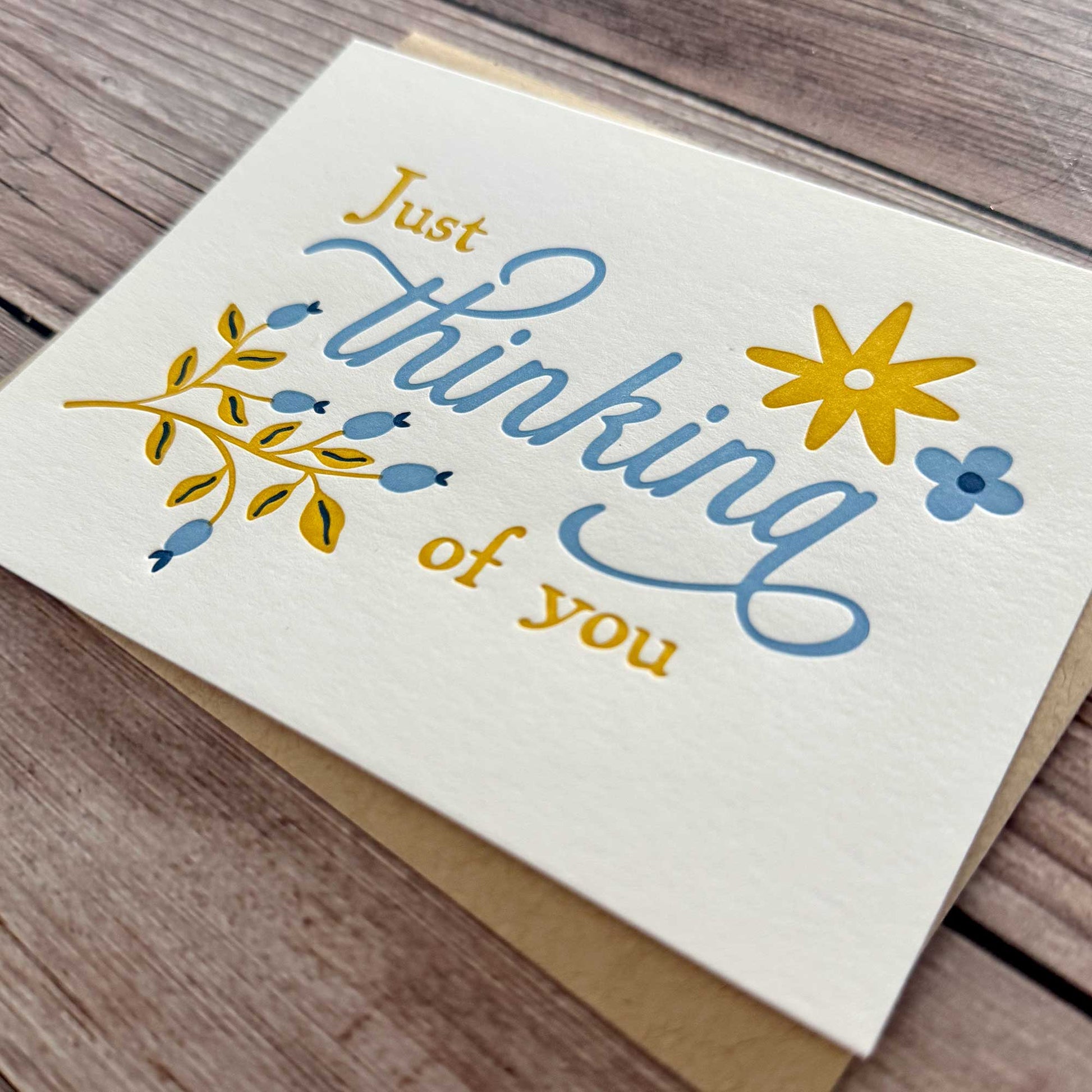 "Thinking of You" card. Floral Design, blue and yellow, letterpress printed with Kraft Envelope. Whether you’re reaching out to offer emotional support, checking on a friend, or sending encouragement during a difficult time, this card is the perfect way to express your care. With a beautiful letterpress design, it’s ideal for those navigating a difficult situation, surgery recovery, or needing a thoughtful Get Well Soon or Sympathy Card. Available in single card or boxed sets.