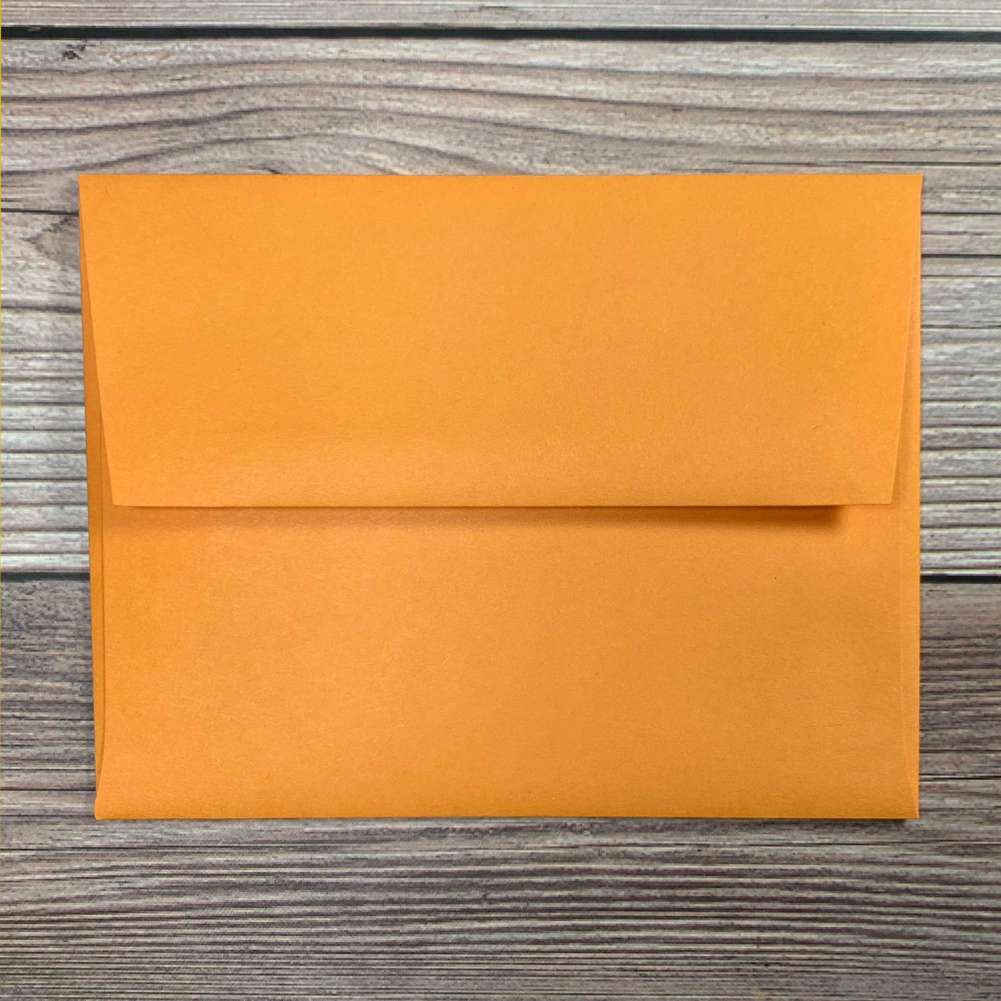 Greeting Card envelope, orange color, square flap, included with letterpress plantable seed card.