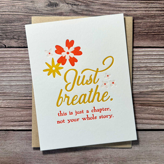 Letterpress printed greeting card, floral design, red and yellow. Just Breathe. This is just a chapter, not your whole story. Our "Just Breathe" card is the perfect way to encourage a loved one who’s going through a tough time, reminding them that this challenging moment is just a chapter, not their whole story. Whether they're facing illness, recovery, or emotional hardship, this beautifully letterpress printed card offers thoughtful Cancer Support, Chemo Care, Stroke Support, or even Divorce Support.